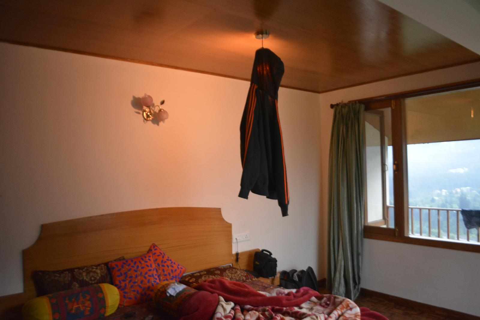 Jacket hung over a lamp in a room