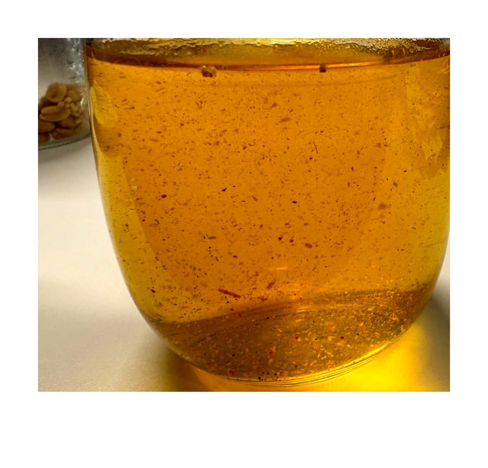 A glass full of tea leaves